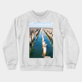 Rows of old wooden wharf piles in Melbourne, Australia. Crewneck Sweatshirt